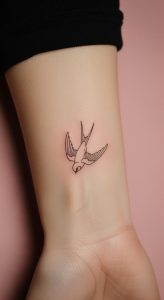 Fine line minimalist swallow tattoo on fair inner wrist, soft lighting, pink background, delicate body art